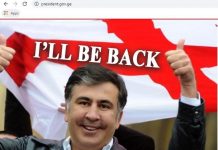 sabiq prezident Mixeil Saakaşvilinin fotosu və "Mən qayıdacağam" sözləri