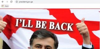 sabiq prezident Mixeil Saakaşvilinin fotosu və "Mən qayıdacağam" sözləri