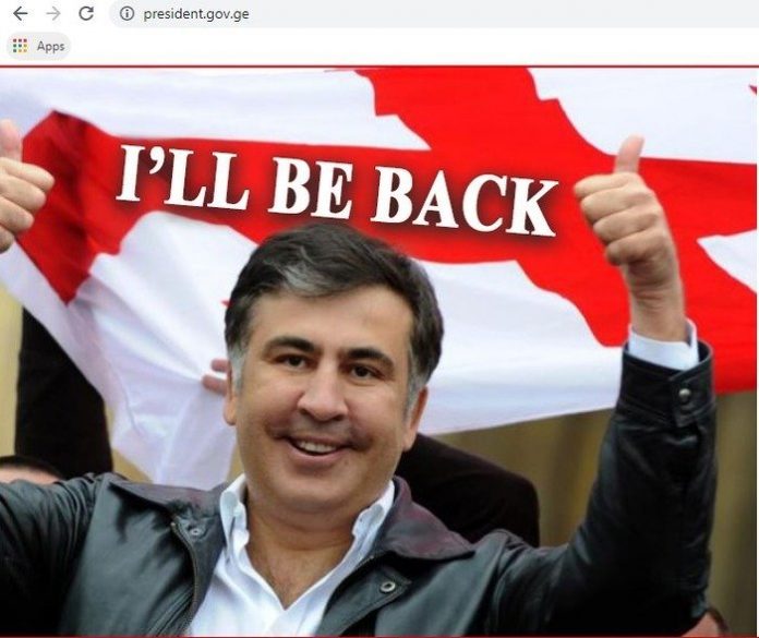 sabiq prezident Mixeil Saakaşvilinin fotosu və "Mən qayıdacağam" sözləri